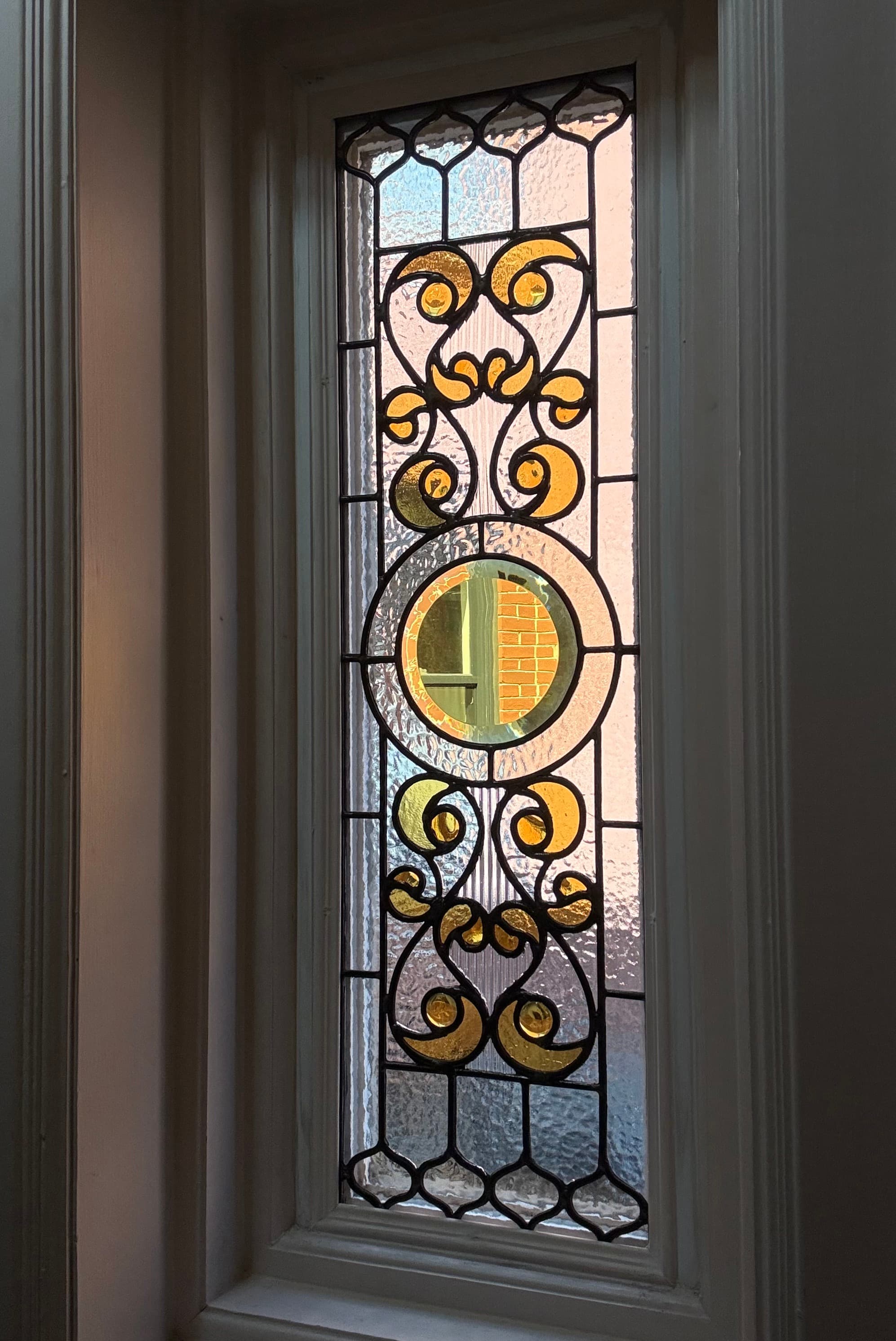 Custom stained glass window designed and handcrafted in Toronto by Sunday Projects