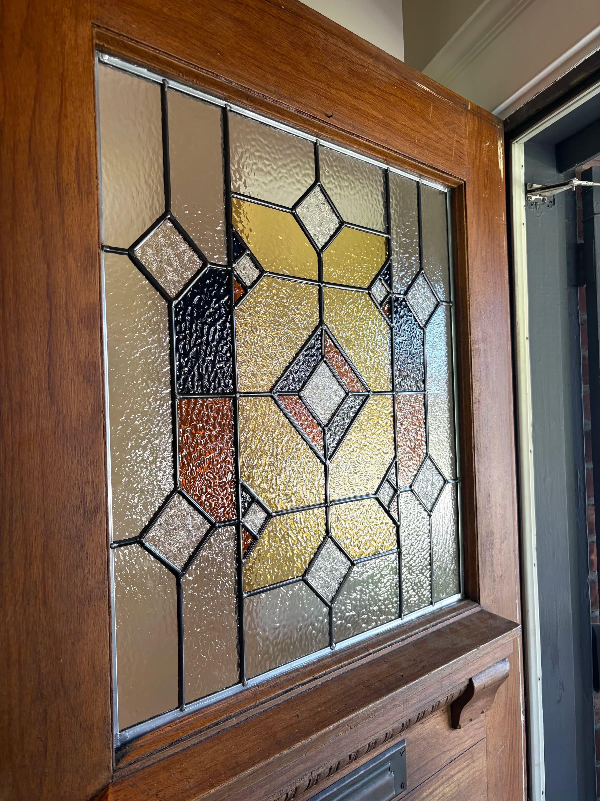 Custom stained glass window designed and handcrafted in Toronto by Sunday Projects